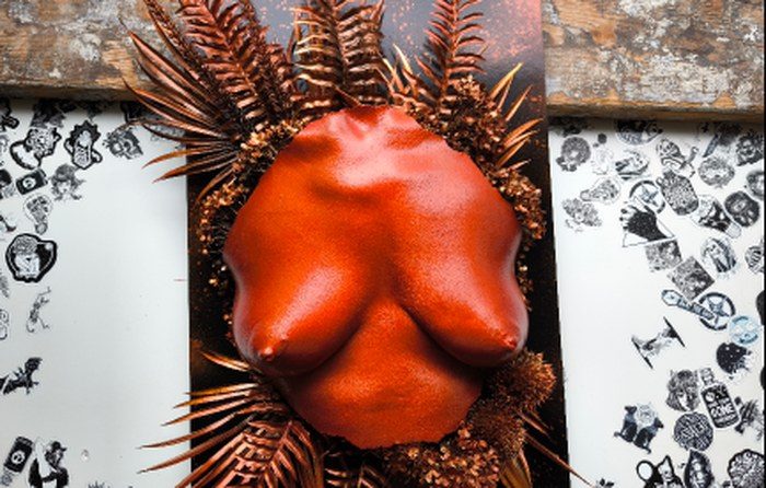 Burnt copper life-cast torso staged among gilded ferns, New York Series